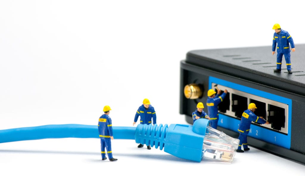 Technicians connecting network cable. Network connection concept